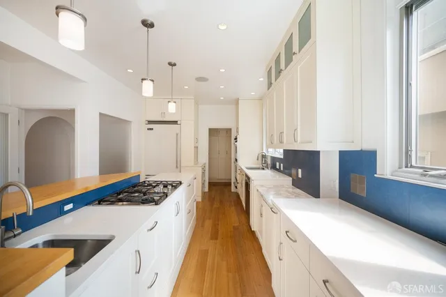 a view of kitchen with furniture and wooden floor
