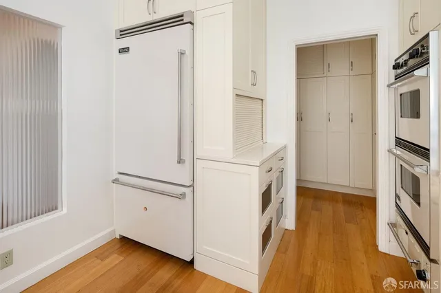 a kitchen with stainless steel appliances granite countertop a stove and a sink