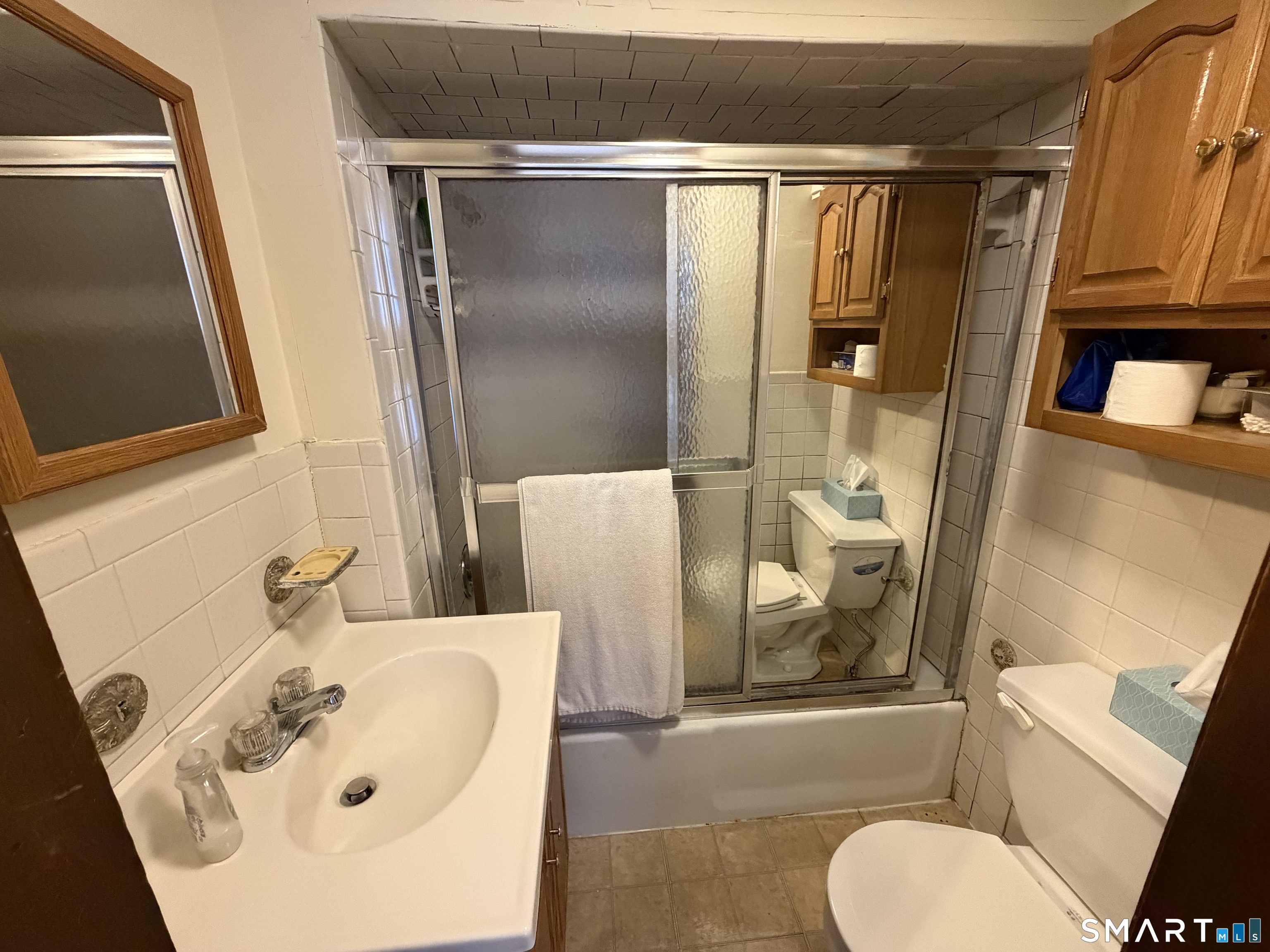 593 Wayne Street Bridgeport, CT 06606 - Photo 19 of 20 a bathroom with a sink and a mirror