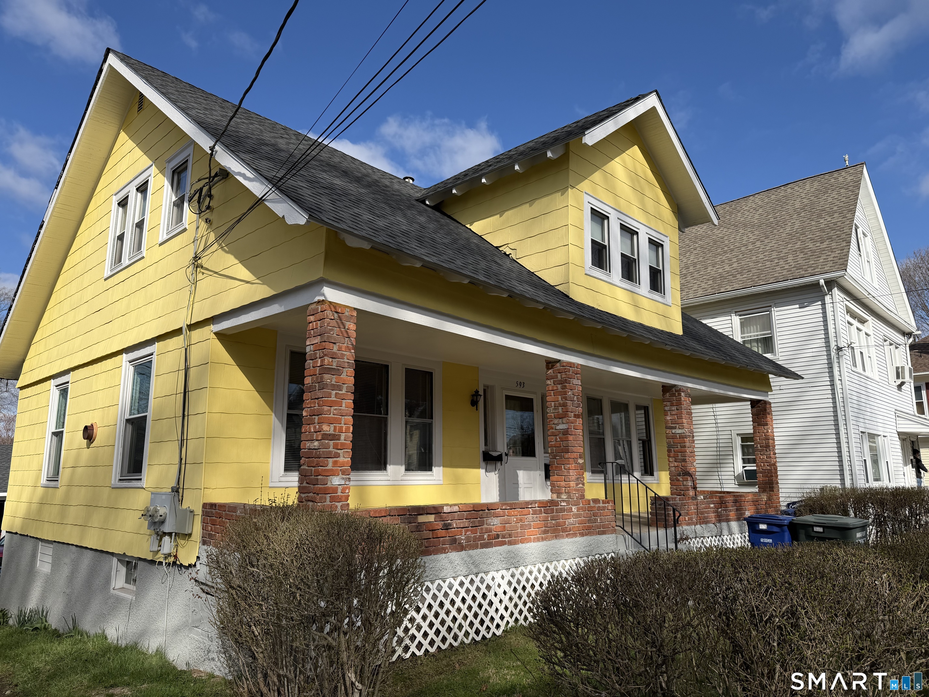 593 Wayne Street Bridgeport, CT 06606 - Photo 2 of 20 a front view of a house with a yard