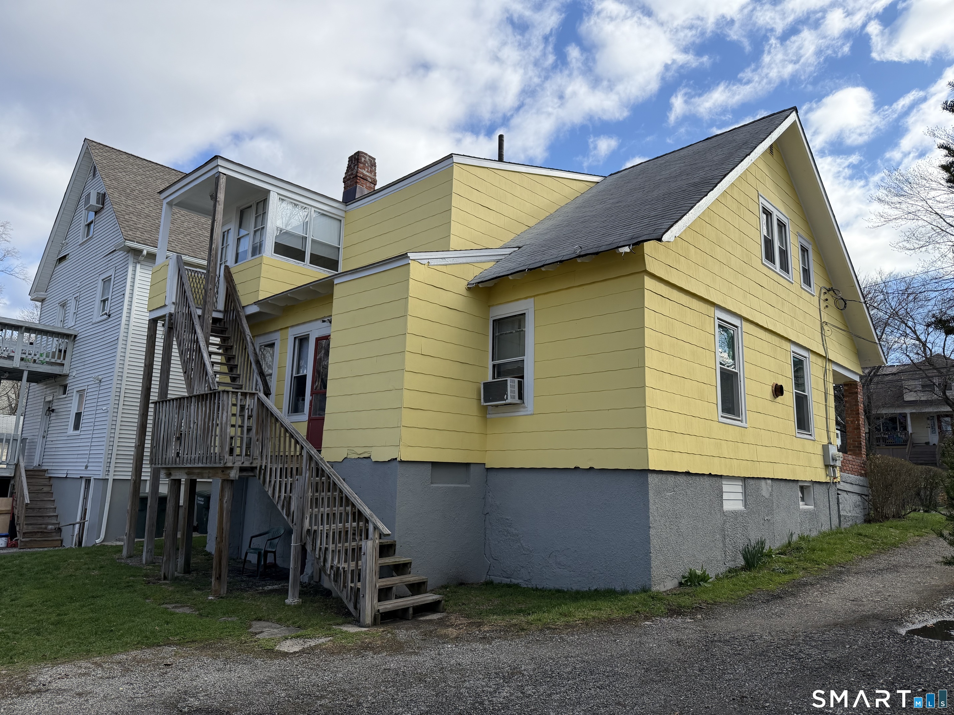 593 Wayne Street Bridgeport, CT 06606 - Photo 3 of 20 a view of a house with a yard