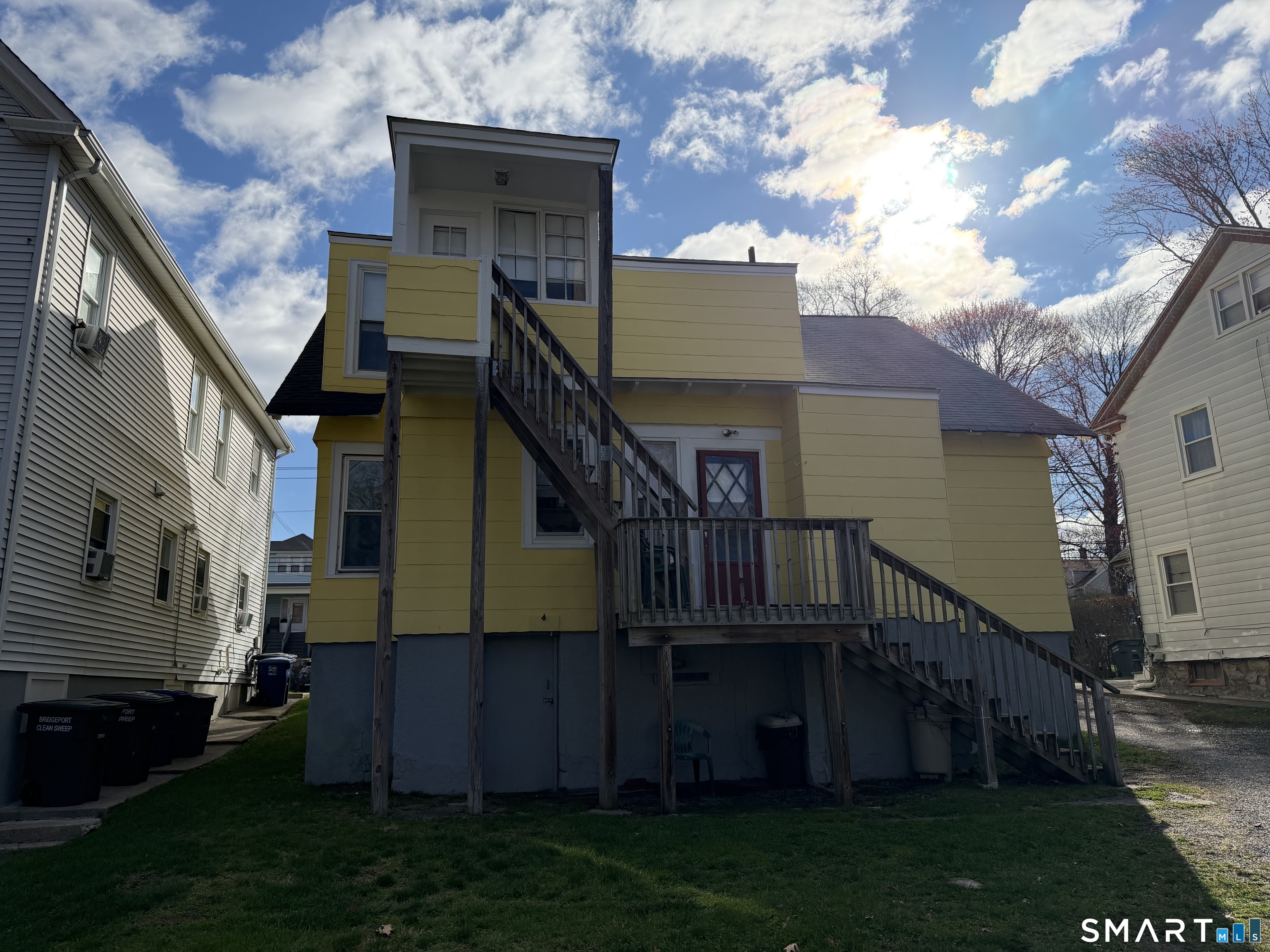 593 Wayne Street Bridgeport, CT 06606 - Photo 4 of 20 a view of house with yard and staircase