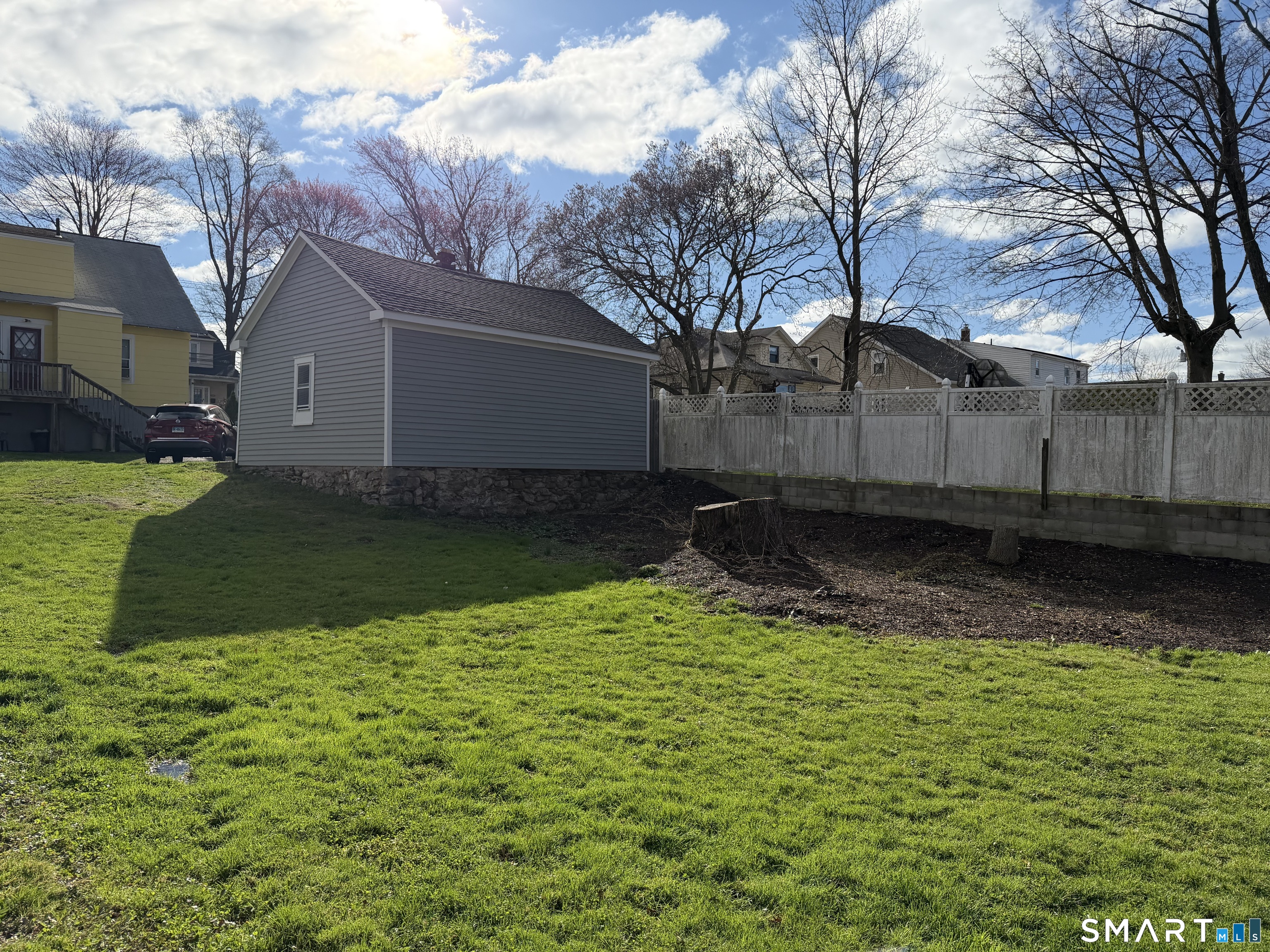 593 Wayne Street Bridgeport, CT 06606 - Photo 7 of 20 a view of a backyard of the house