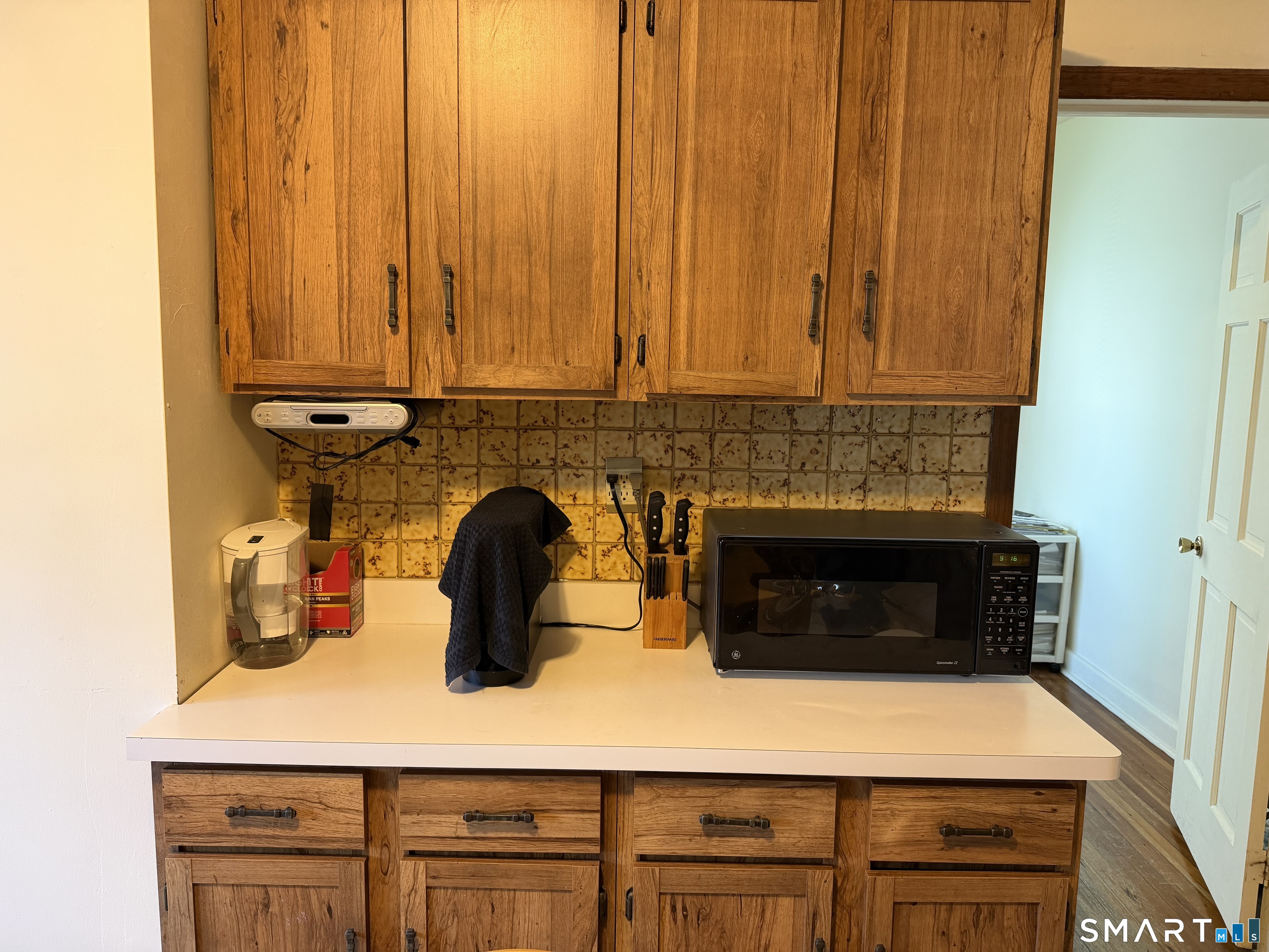 593 Wayne Street Bridgeport, CT 06606 - Photo 9 of 20 a kitchen with a stove and cabinets