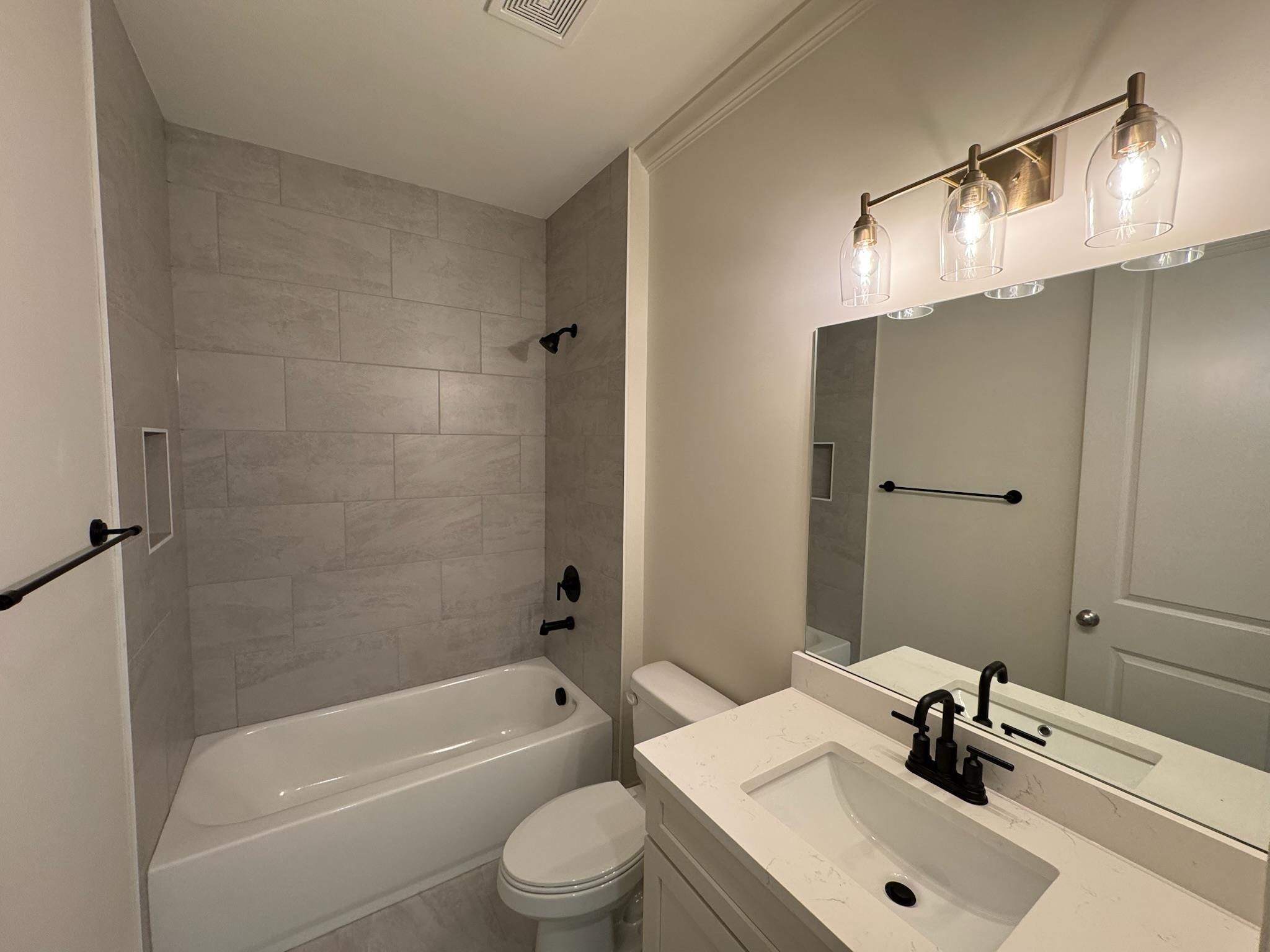 11512 Sunsparkler Way Collierville, TN 38017 - Photo 16 of 40 Full bath featuring vanity and bathing tub / shower combination