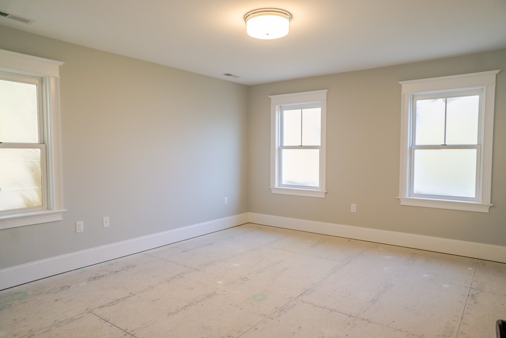 322 Maynard Road Sudbury, MA 01776 - Photo 14 of 24 an empty room with windows