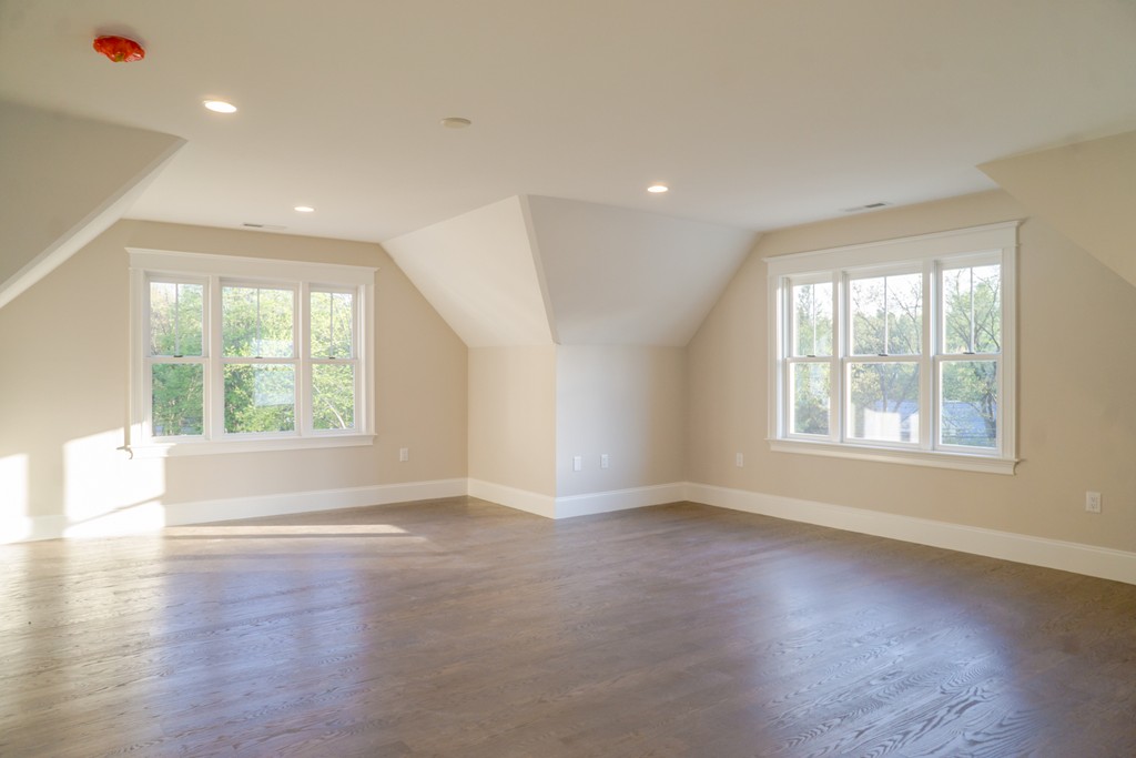 322 Maynard Road Sudbury, MA 01776 - Photo 19 of 24 an empty room with wooden floor and windows