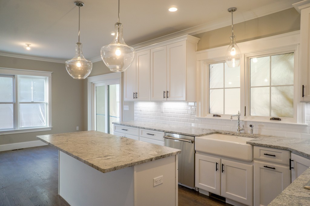 322 Maynard Road Sudbury, MA 01776 - Photo 2 of 24 a kitchen with a sink cabinets and window