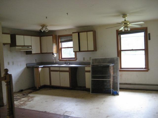 199 Polikoff Road Sheffield, MA 01222 - Photo 2 of 10 a kitchen with a sink cabinets and window