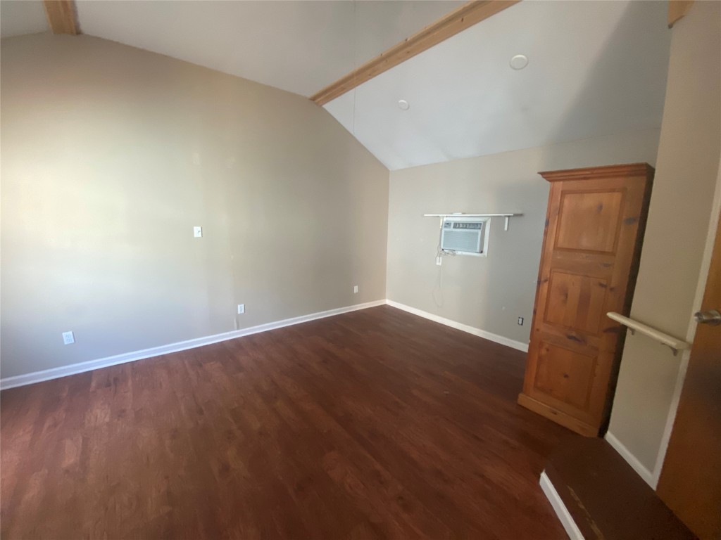 3300 Lafayette Avenue, Unit B Austin, TX 78722 - Photo 7 of 13 Bonus room featuring dark wood-style floors and baseboards