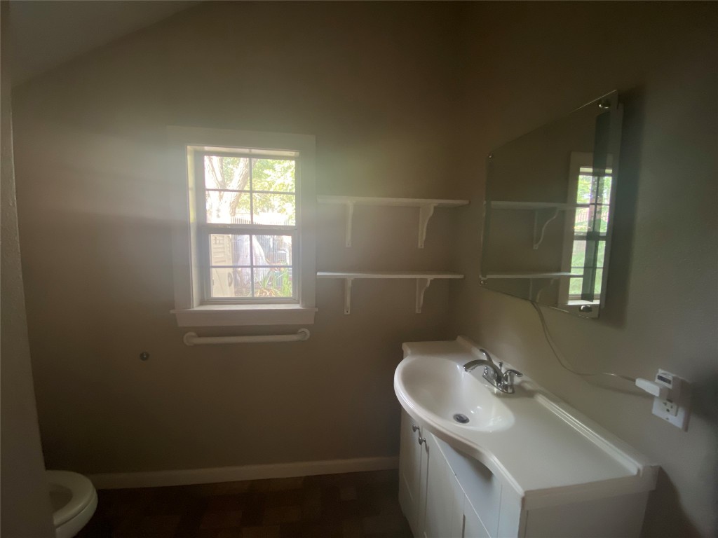 3300 Lafayette Avenue, Unit B Austin, TX 78722 - Photo 9 of 13 Bathroom with vanity and vaulted ceiling