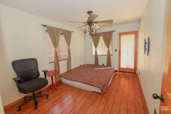 a bedroom with a bed and a chair