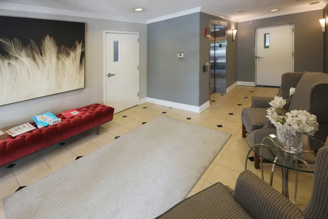 a bedroom with a bed and ceiling fan