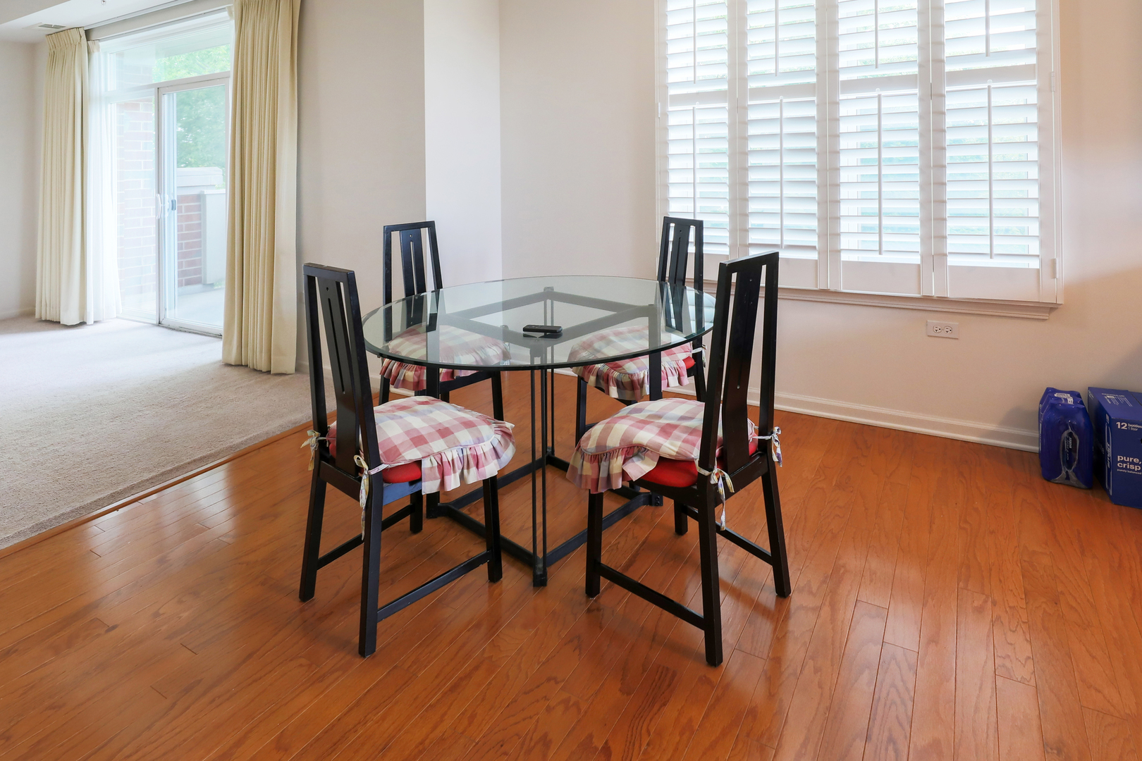 77 North Quentin Road, Unit 414 Palatine, IL 60067 - Photo 4 of 16 a view of a dining room with furniture and wooden floor