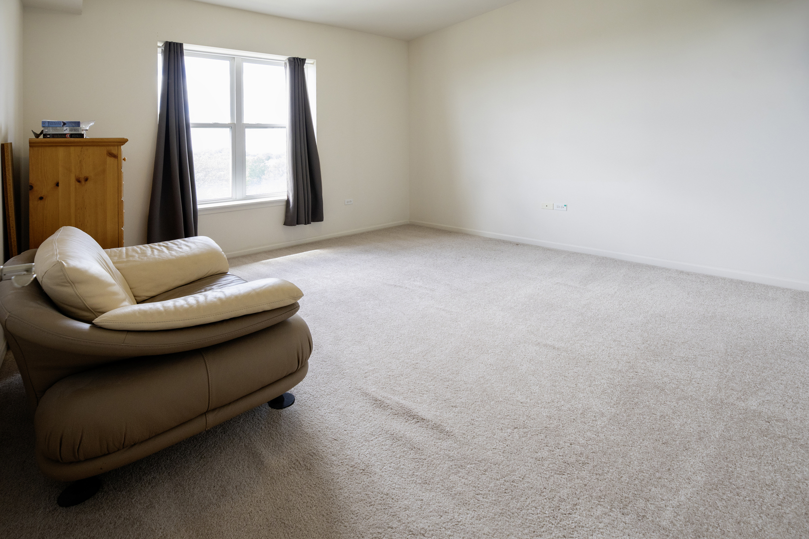 77 North Quentin Road, Unit 414 Palatine, IL 60067 - Photo 10 of 16 a living room with furniture and a window
