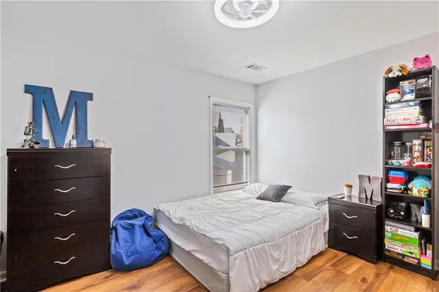 a bedroom with a bed and furniture