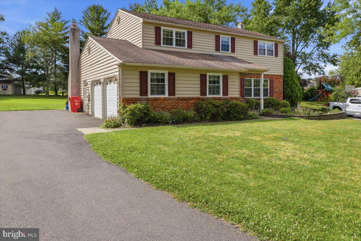 148 Regency Drive Eagleville, PA 19403 - Photo 3 of 42 Charming home with lush green surroundings.