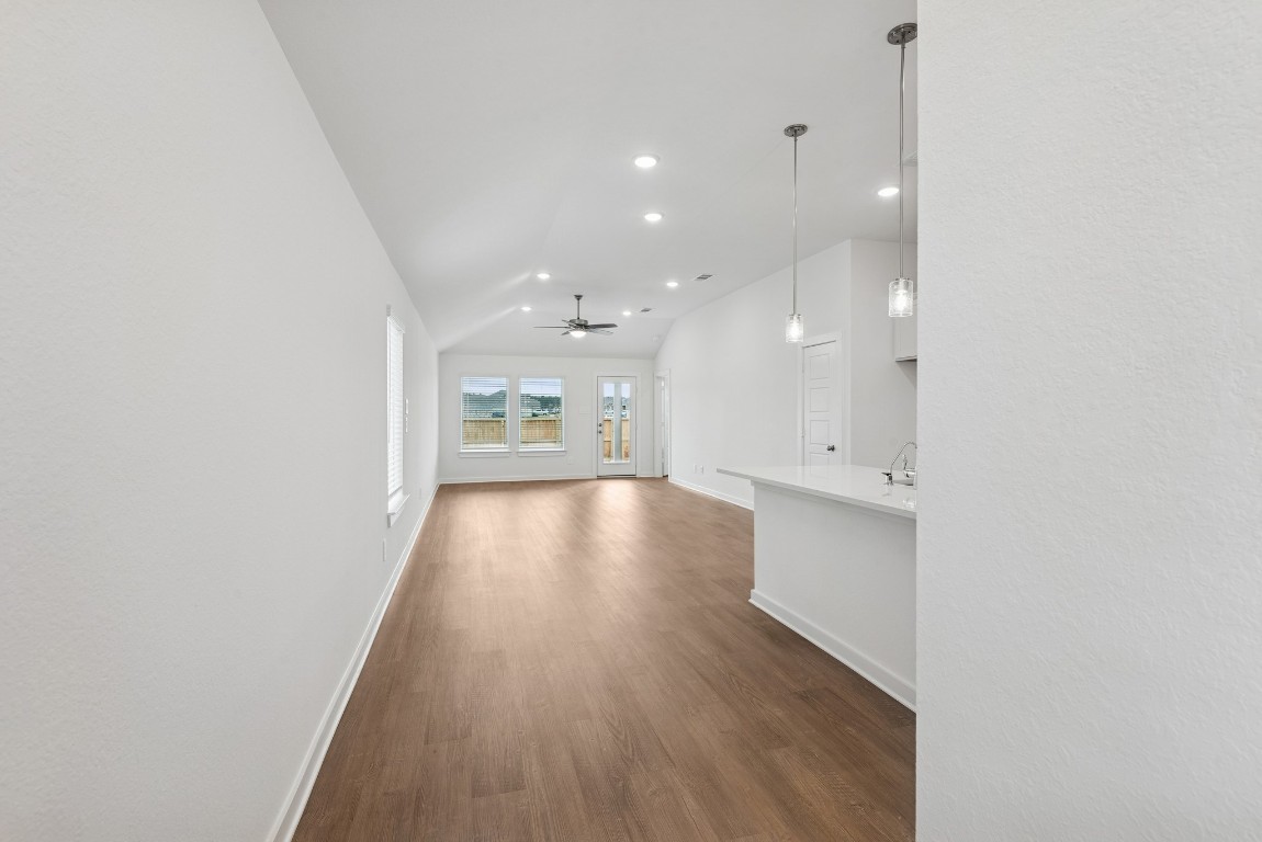 540 Flower Reed Court Magnolia, TX 77354 - Photo 16 of 45 an empty room with wooden floor and windows