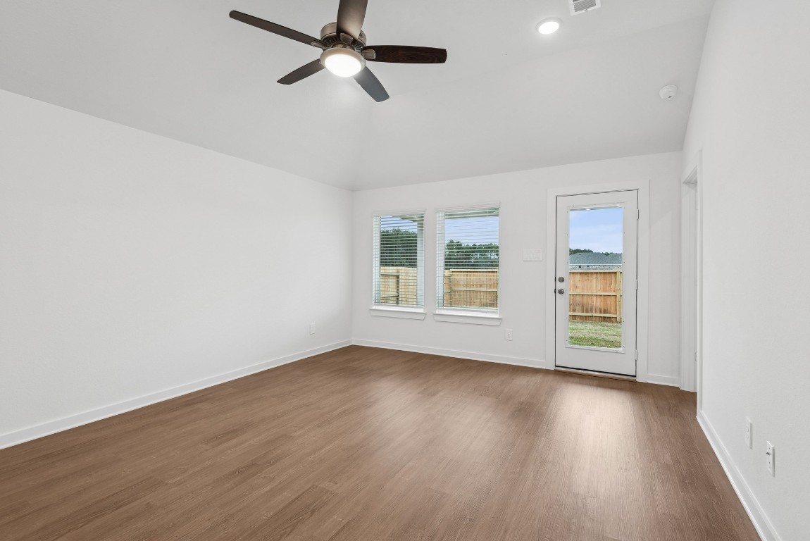 540 Flower Reed Court Magnolia, TX 77354 - Photo 26 of 45 an empty room with wooden floor fan and windows