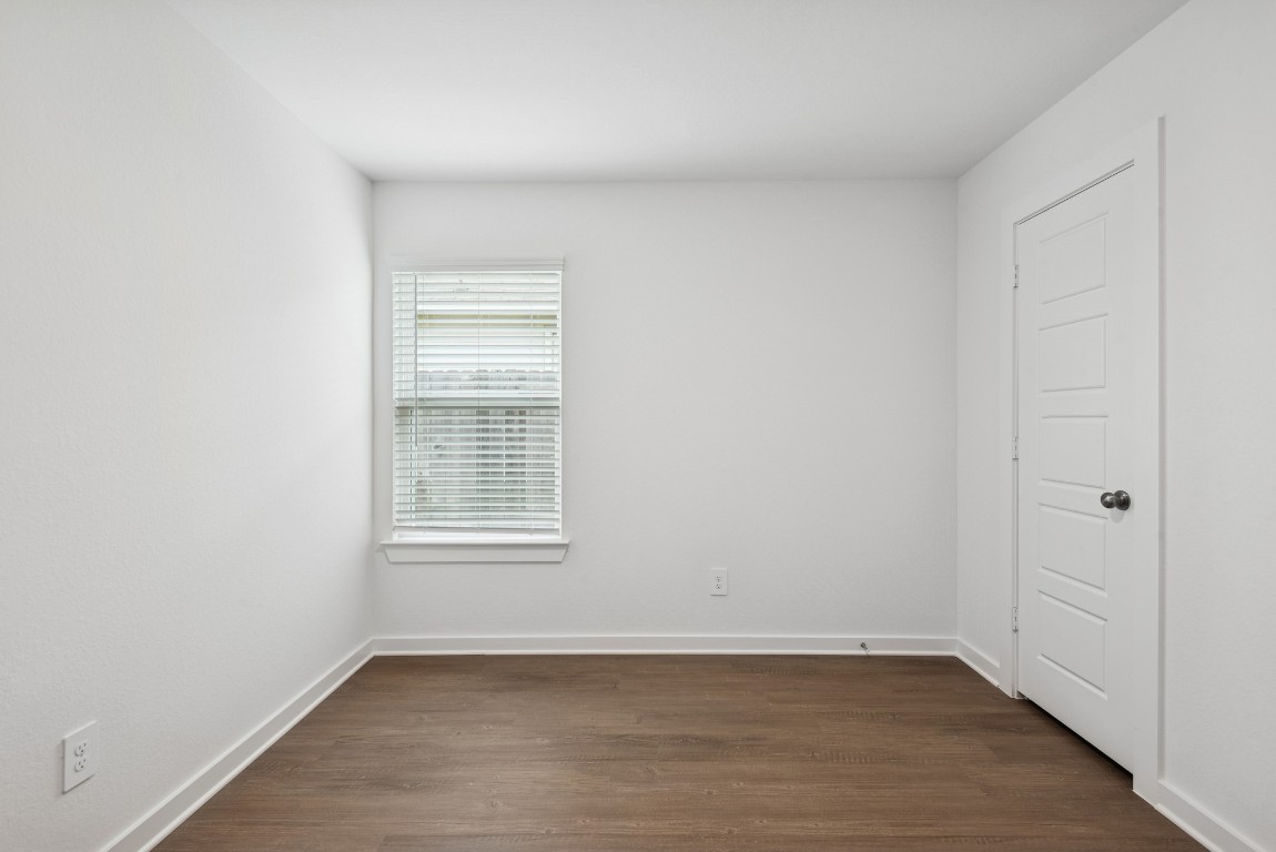 540 Flower Reed Court Magnolia, TX 77354 - Photo 28 of 45 a view of an empty room with wooden floor and a window