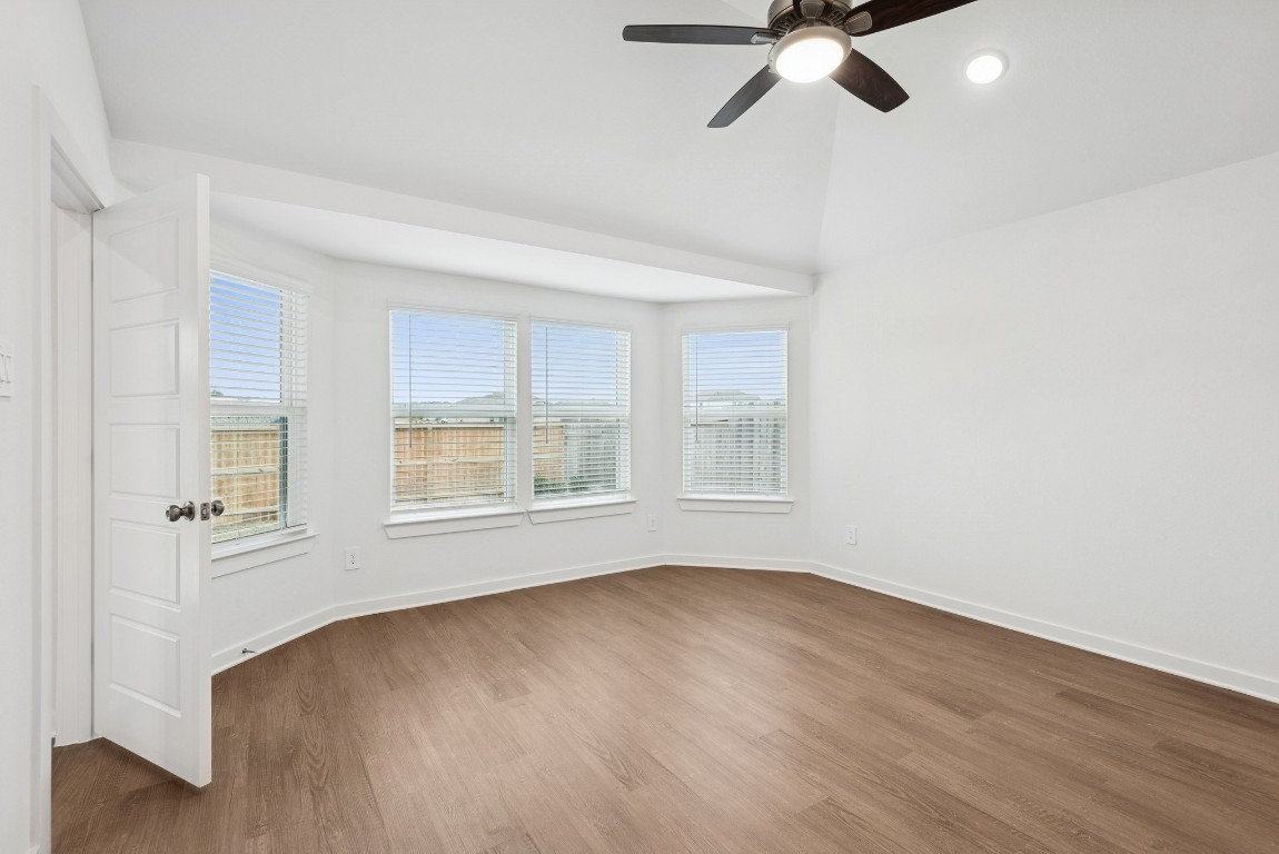 540 Flower Reed Court Magnolia, TX 77354 - Photo 36 of 45 a view of an empty room with a window and wooden floor