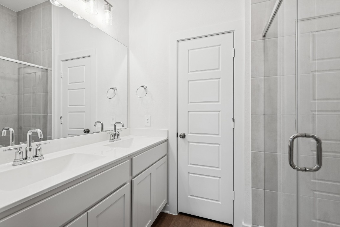 540 Flower Reed Court Magnolia, TX 77354 - Photo 5 of 45 a bathroom with a sink and a mirror