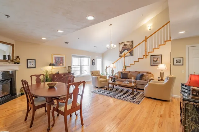 a living room with lots of furniture and wooden floor