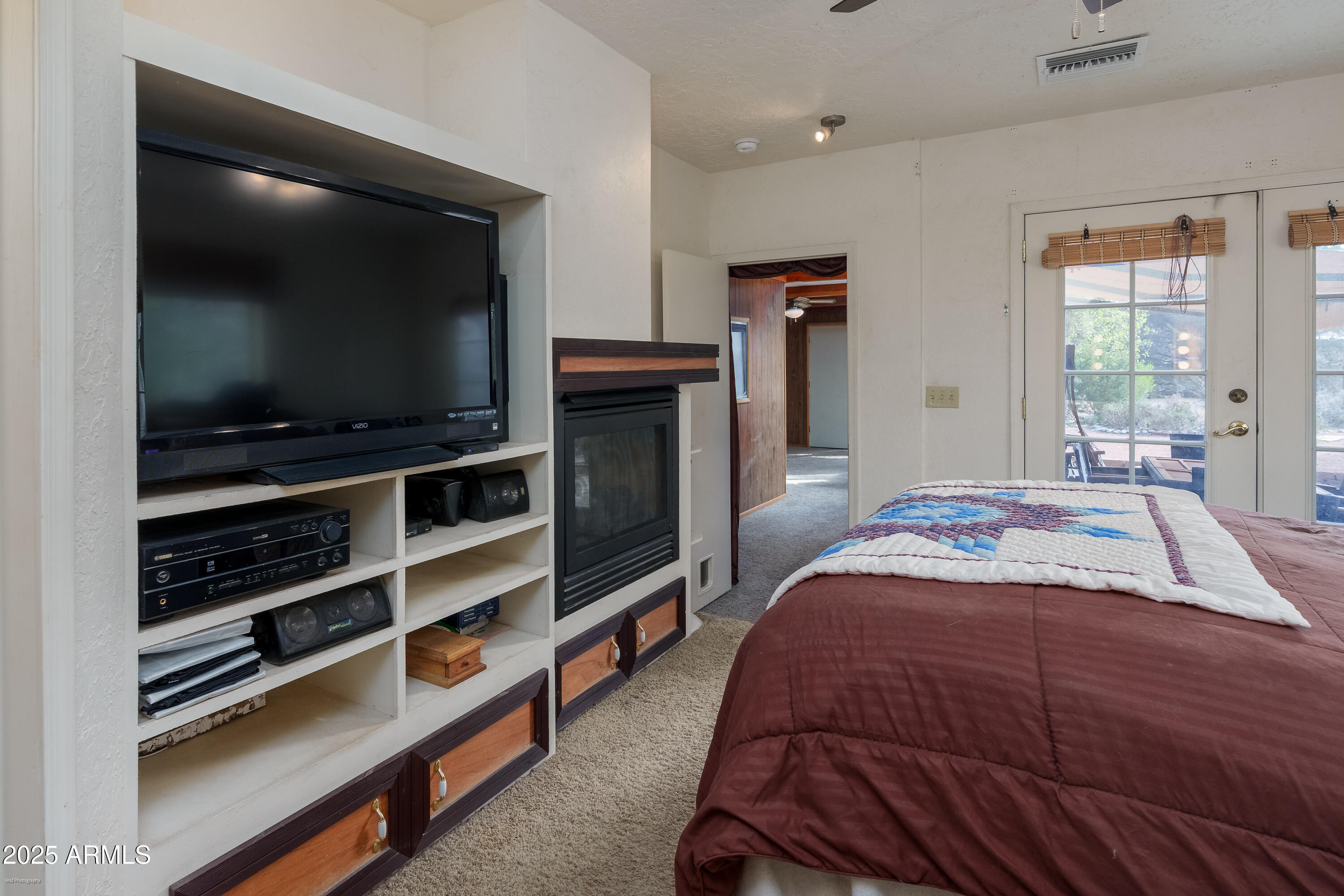 3510 East Maybe Manana Way Rimrock, AZ 86335 - Photo 11 of 36 a bedroom with a bed and a flat screen tv