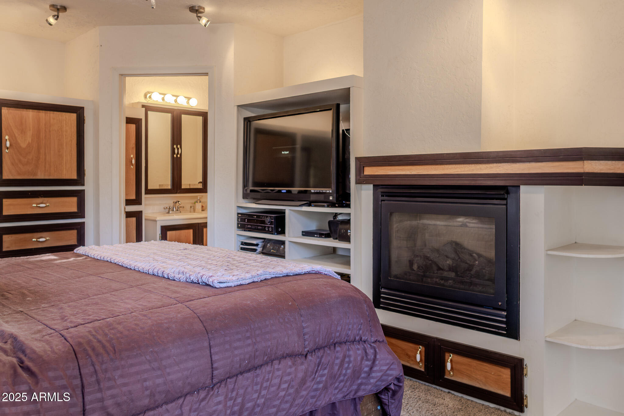 3510 East Maybe Manana Way Rimrock, AZ 86335 - Photo 13 of 36 a bedroom with a bed and a television in it