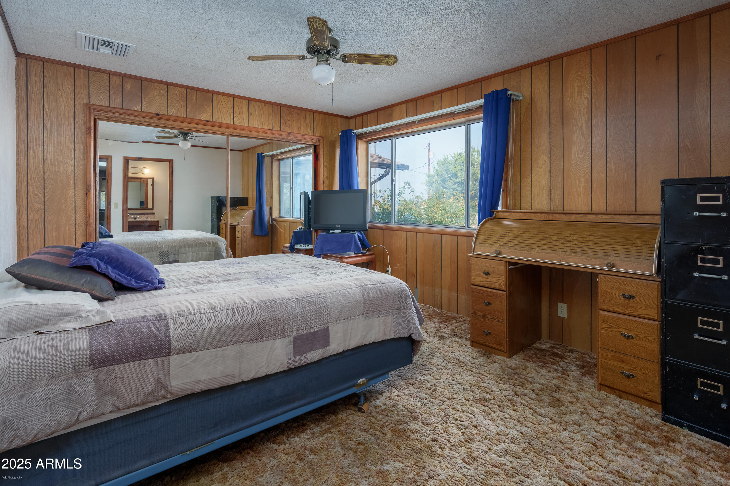 3510 East Maybe Manana Way Rimrock, AZ 86335 - Photo 16 of 36 a bedroom with a bed dresser and a window