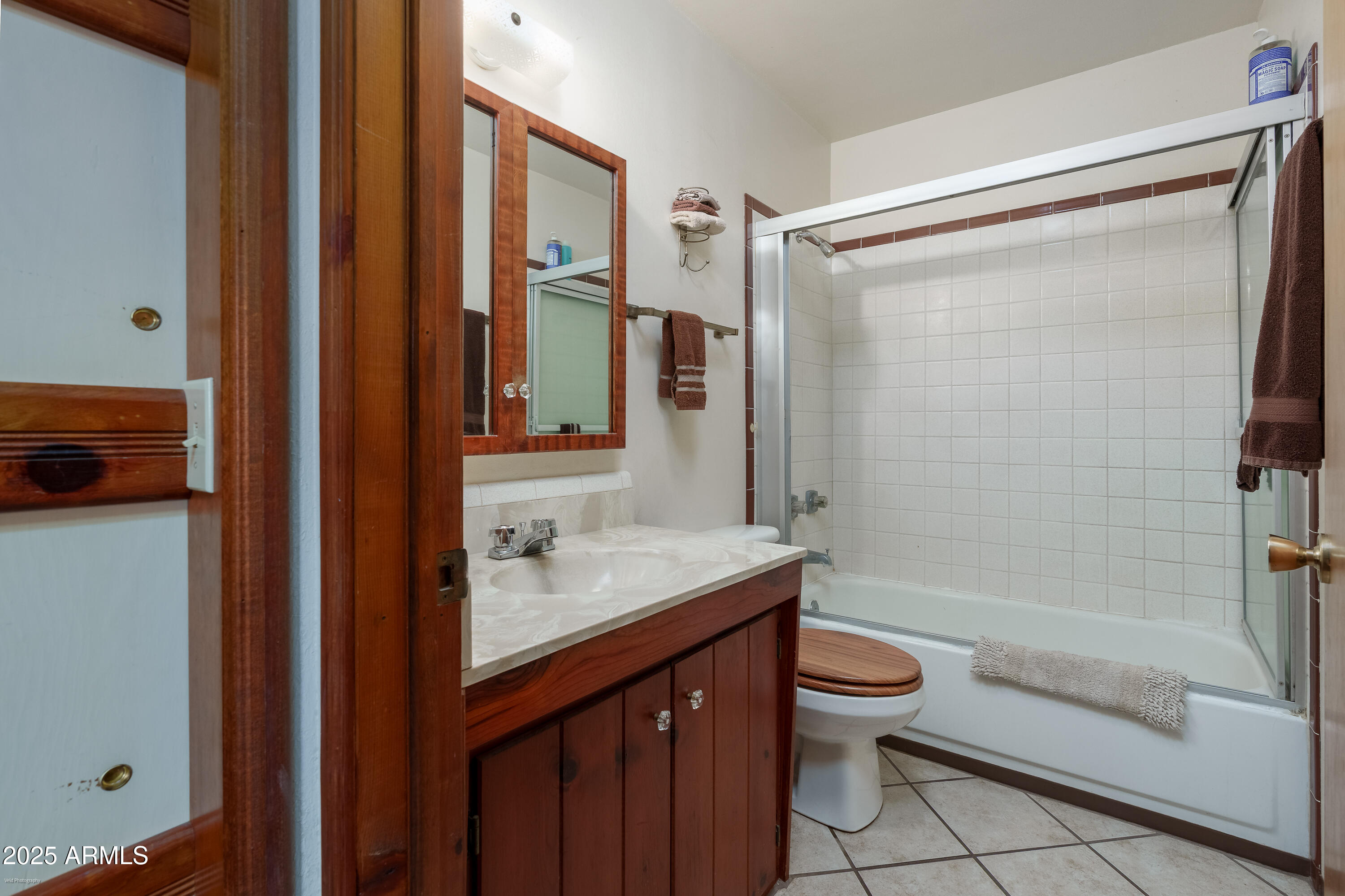 3510 East Maybe Manana Way Rimrock, AZ 86335 - Photo 19 of 36 a bathroom with a sink a toilet and shower