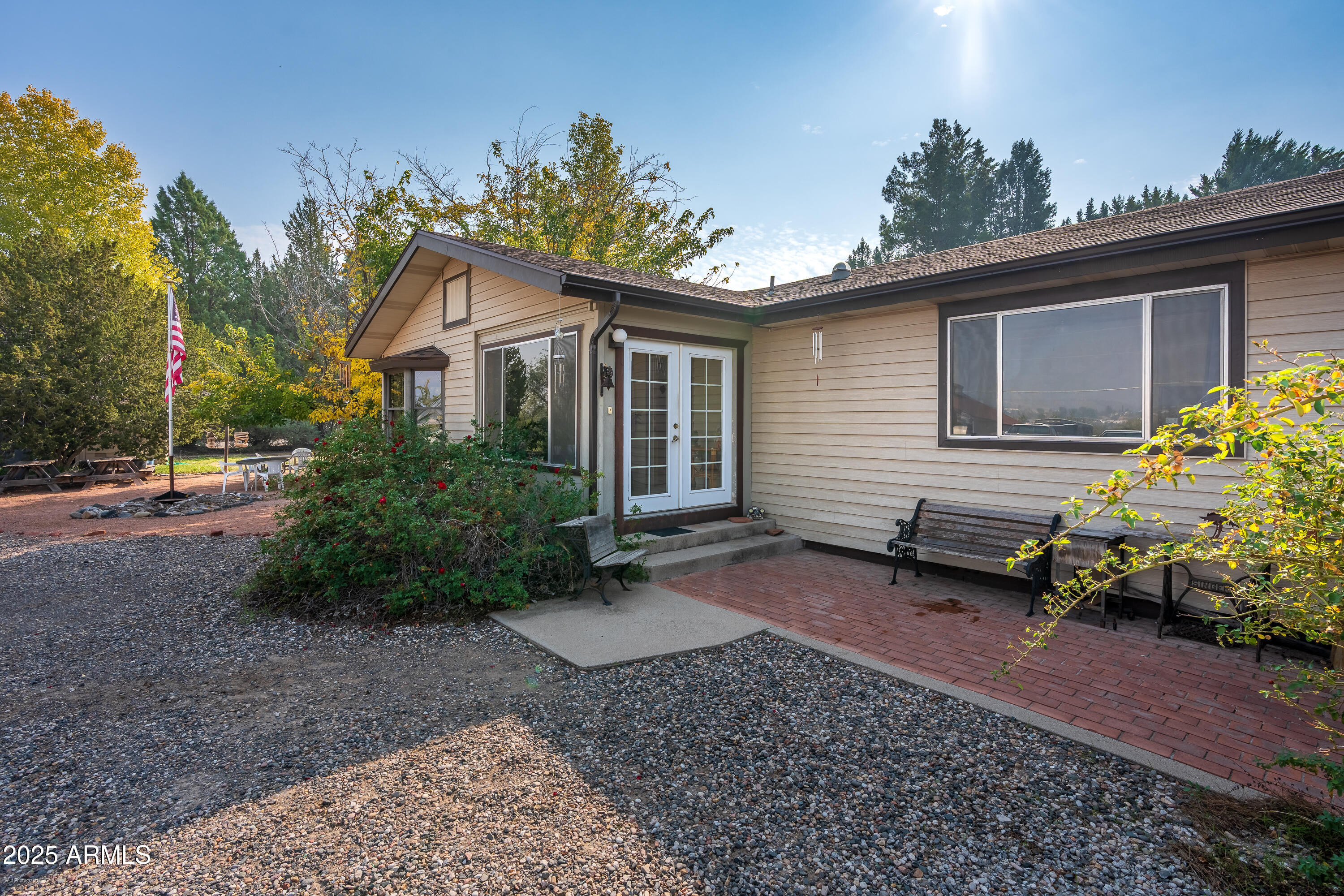 3510 East Maybe Manana Way Rimrock, AZ 86335 - Photo 2 of 36 a view of a house with a yard and a garden