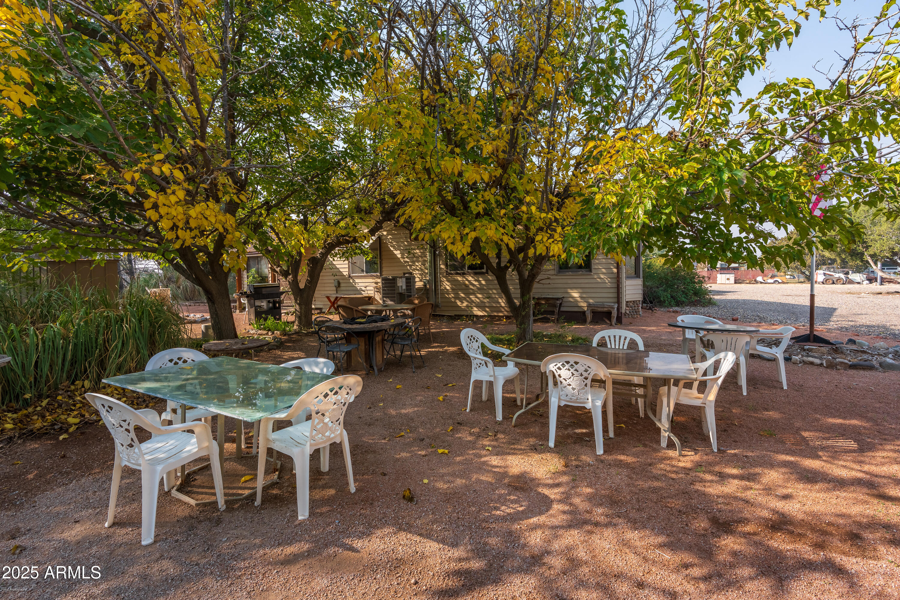 3510 East Maybe Manana Way Rimrock, AZ 86335 - Photo 22 of 36 a view of a dining table and chairs in a patio