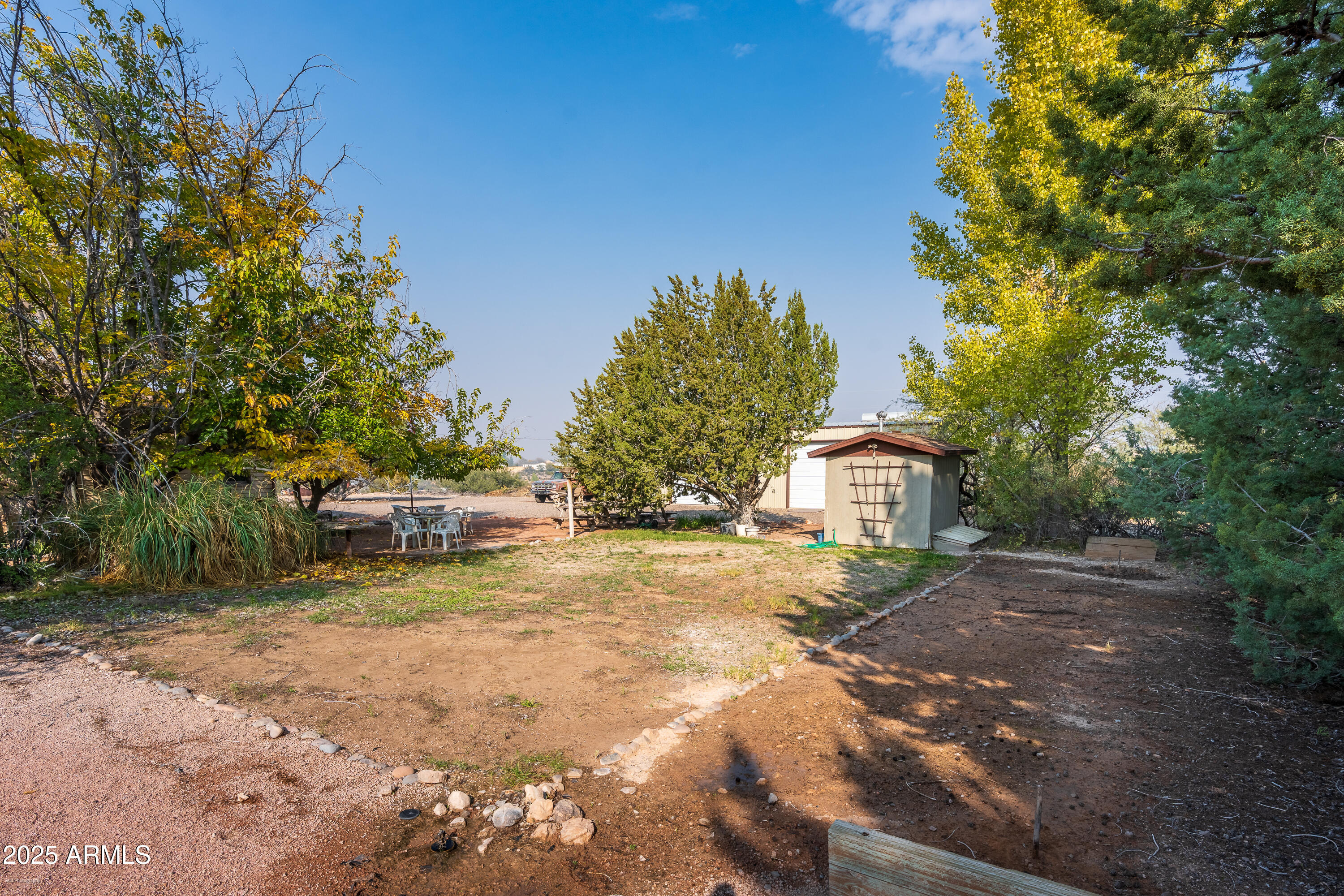 3510 East Maybe Manana Way Rimrock, AZ 86335 - Photo 23 of 36 a view of a house with backyard and trees