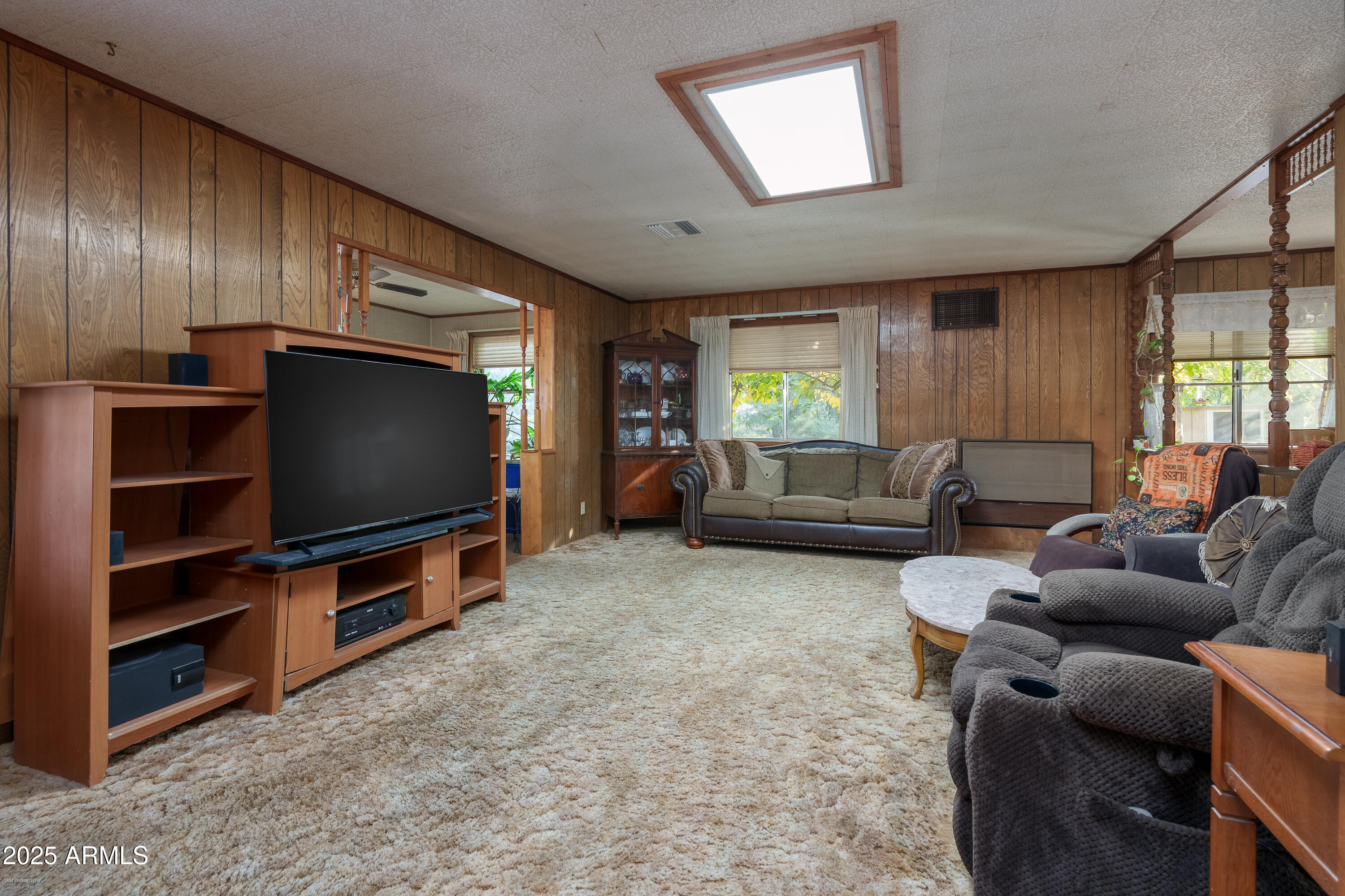 3510 East Maybe Manana Way Rimrock, AZ 86335 - Photo 6 of 36 a living room with furniture and a flat screen tv