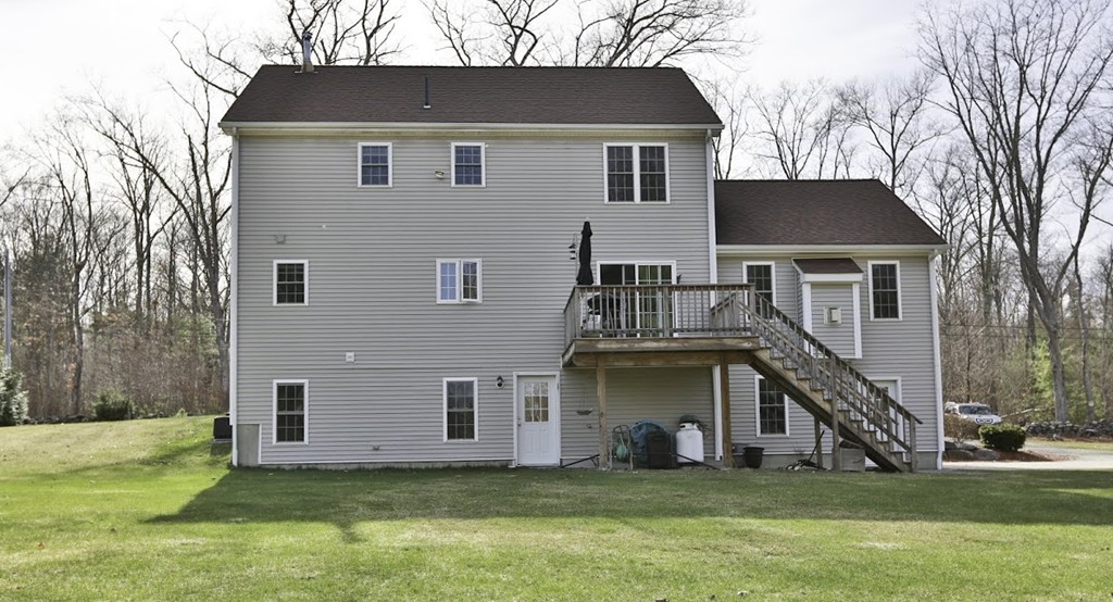 501 Oakham Road Barre, MA 01005 - Photo 25 of 25 a house that has a big yard plants and large trees