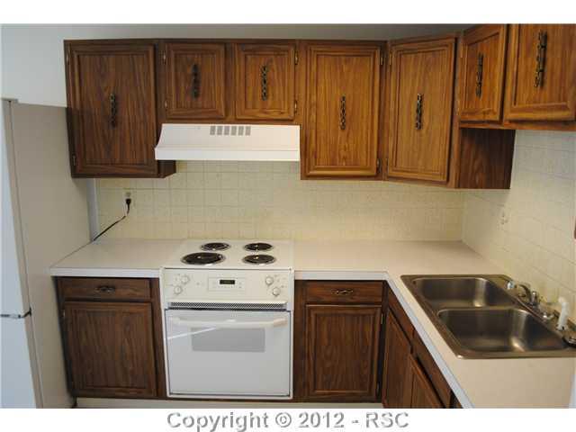 7115 Chippewa Road Colorado Springs, CO 80915 - Photo 3 of 16 Plenty of counter and cabinet space also features an eating nook
