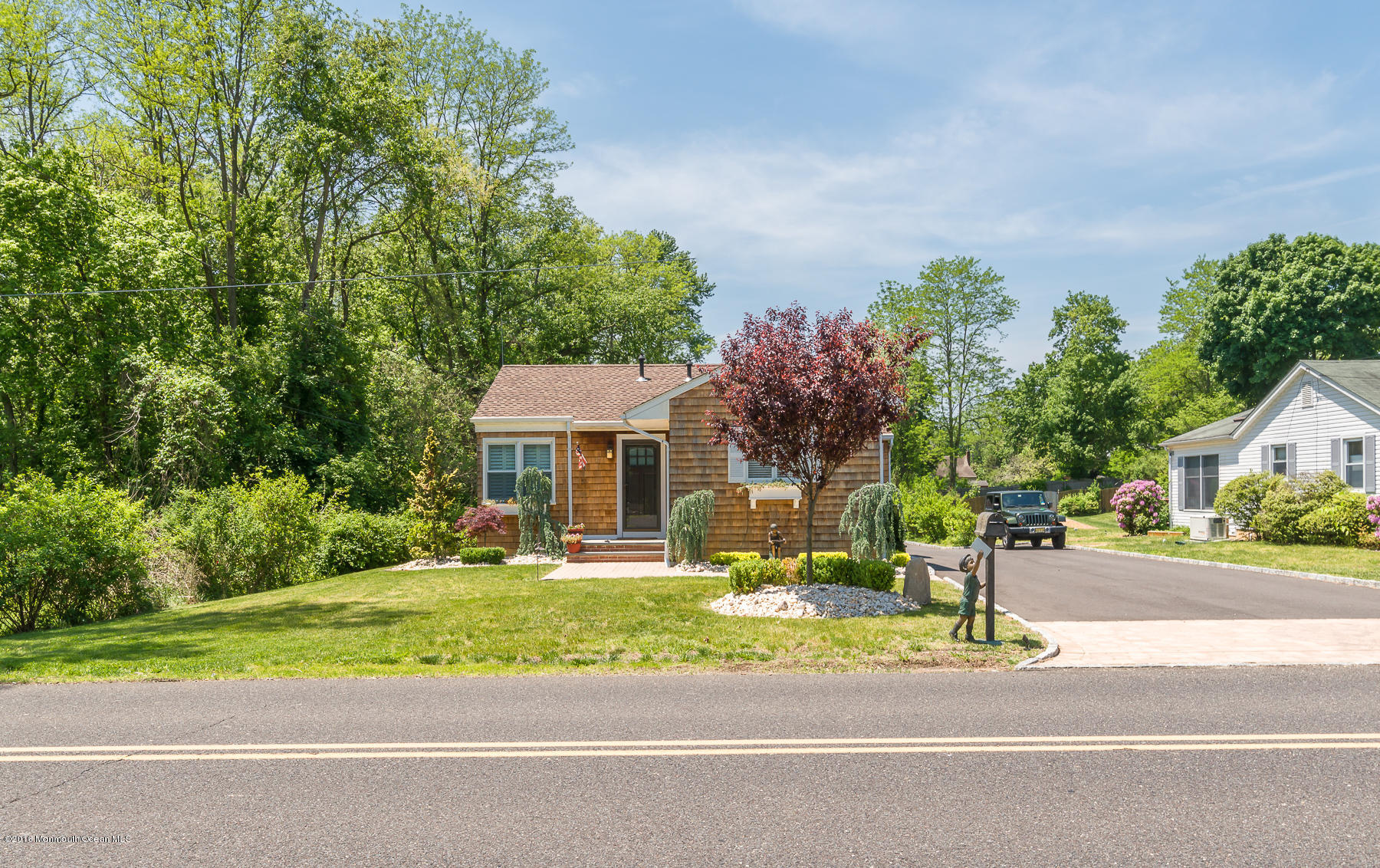 17 Heyers Mill Road Colts Neck, NJ 07722 - Photo 1 of 26 front view of a house with a yard