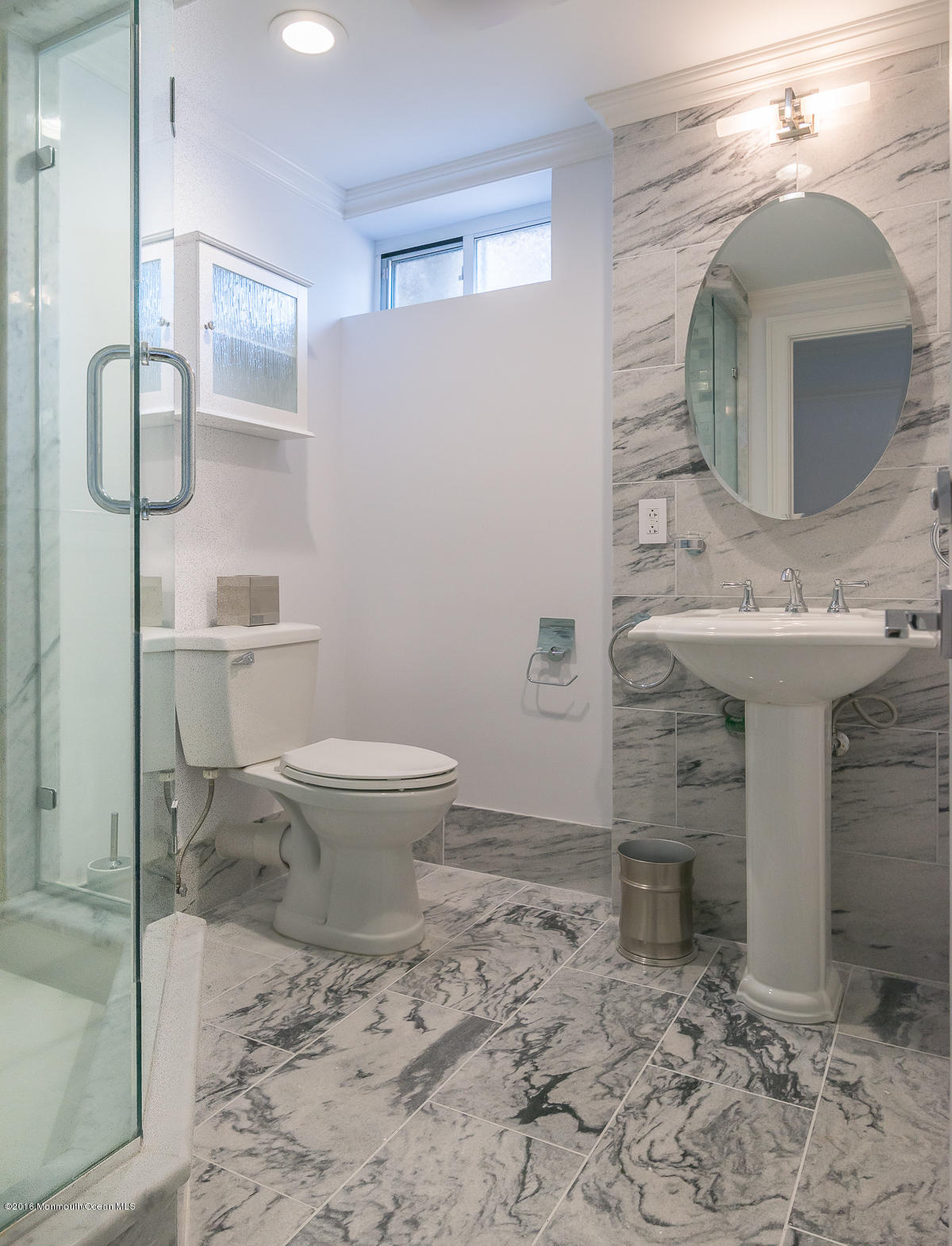 17 Heyers Mill Road Colts Neck, NJ 07722 - Photo 16 of 26 a bathroom with a sink toilet and mirror