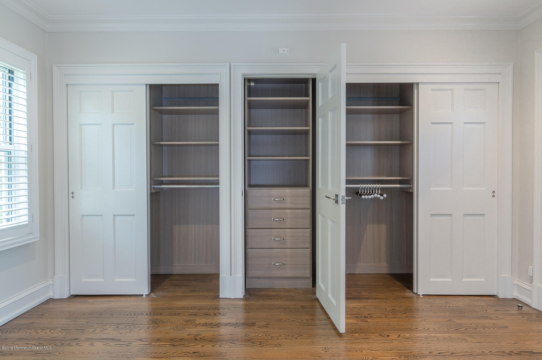 17 Heyers Mill Road Colts Neck, NJ 07722 - Photo 17 of 26 a view of walk in closet with empty racks
