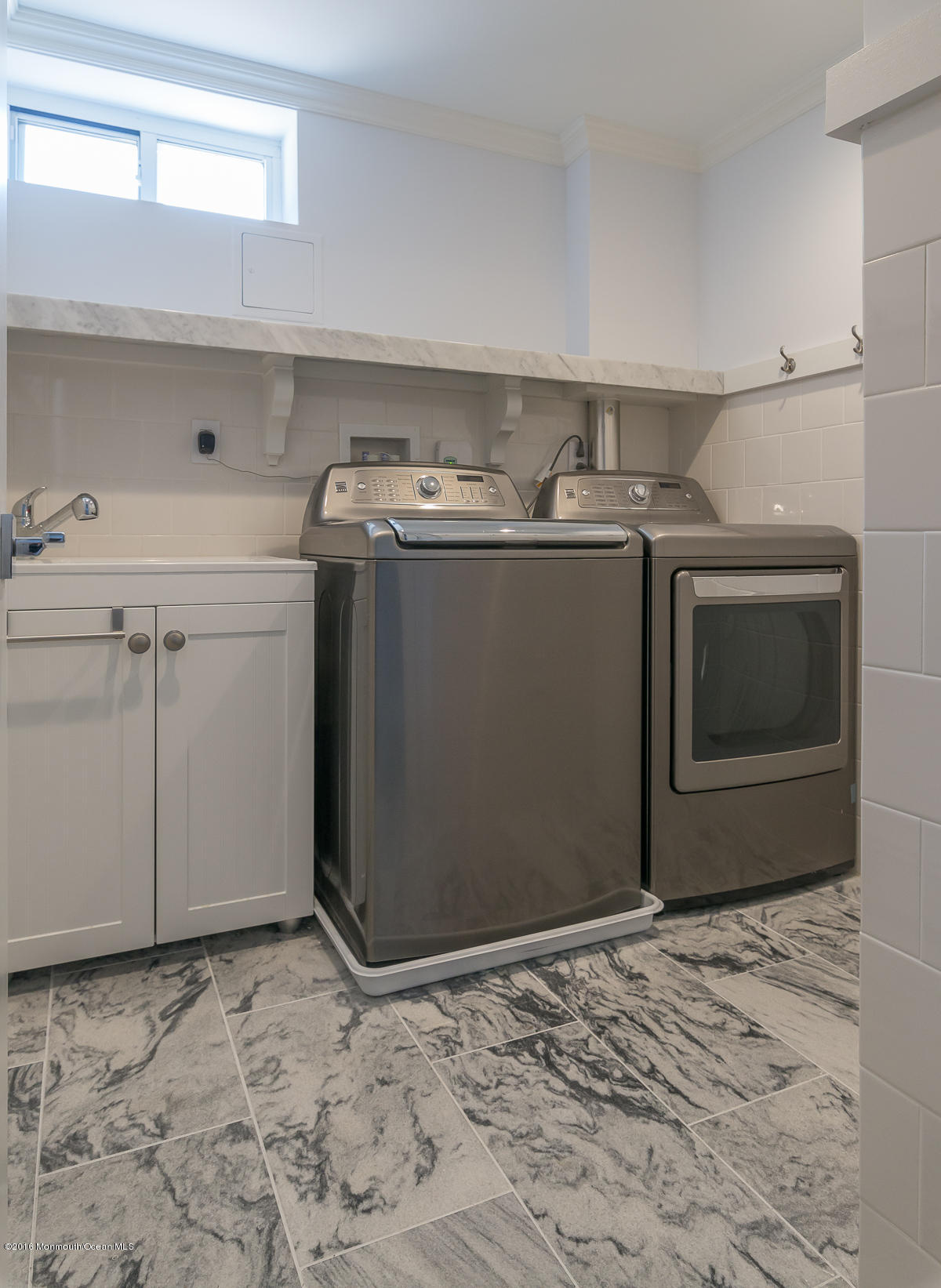 17 Heyers Mill Road Colts Neck, NJ 07722 - Photo 20 of 26 a utility room with dryer and washer