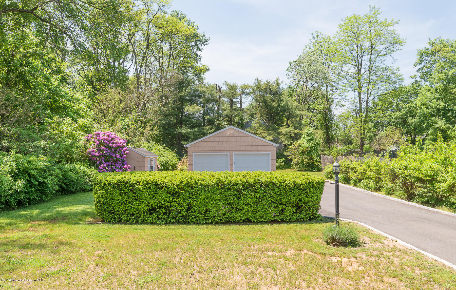 17 Heyers Mill Road Colts Neck, NJ 07722 - Photo 24 of 26 a garden view with a seating space