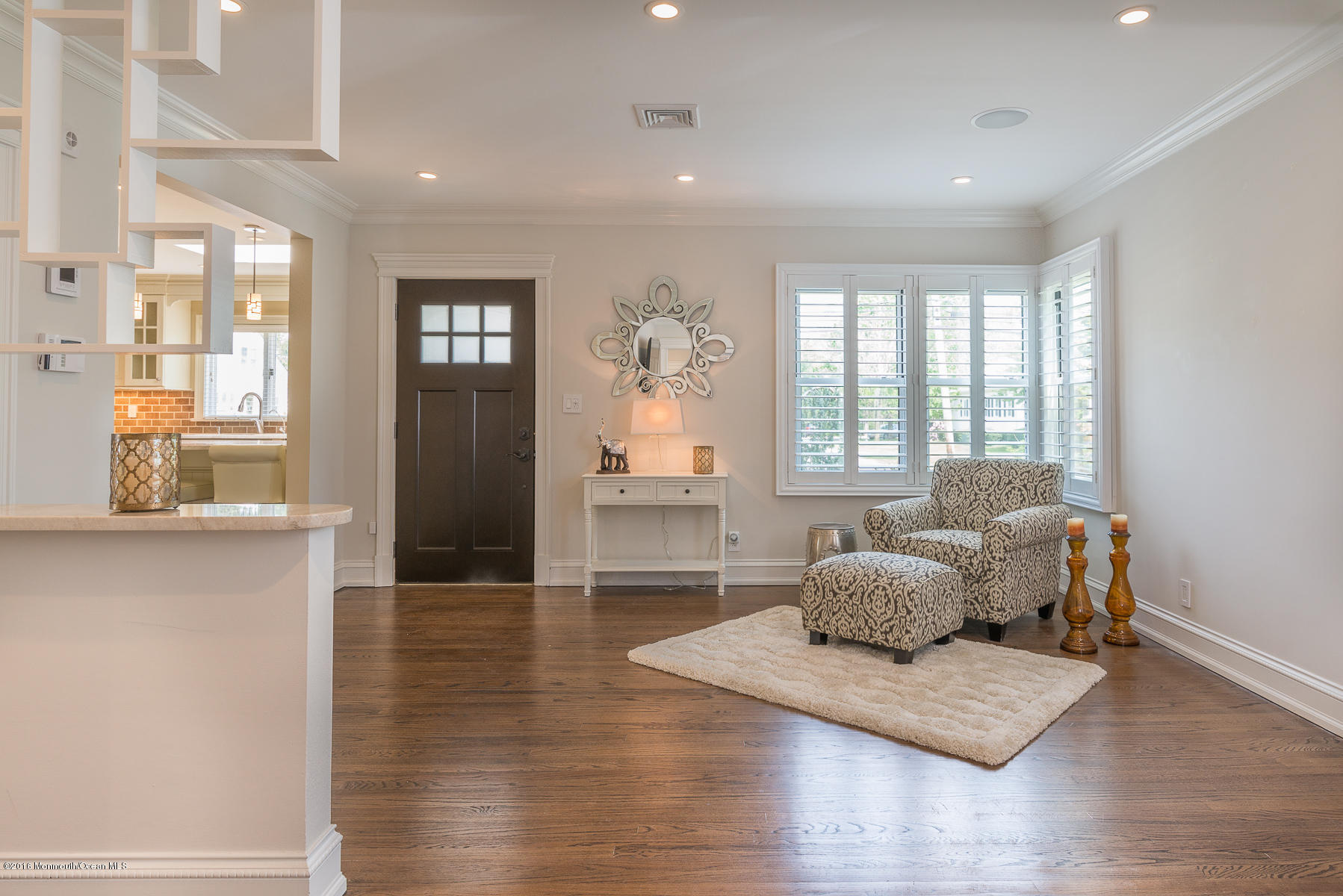 17 Heyers Mill Road Colts Neck, NJ 07722 - Photo 7 of 26 a living room with furniture and wooden floor