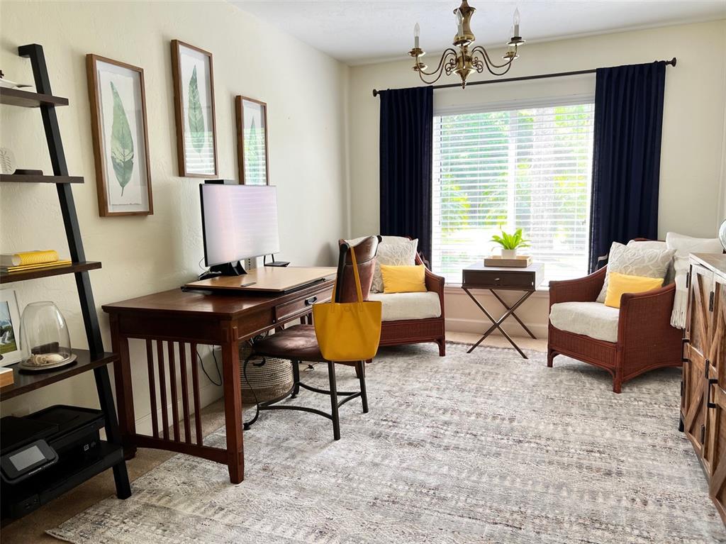 12595 Southeast Sunset Harbor Road Weirsdale, FL 32195 - Photo 6 of 25 a living room with furniture and a window