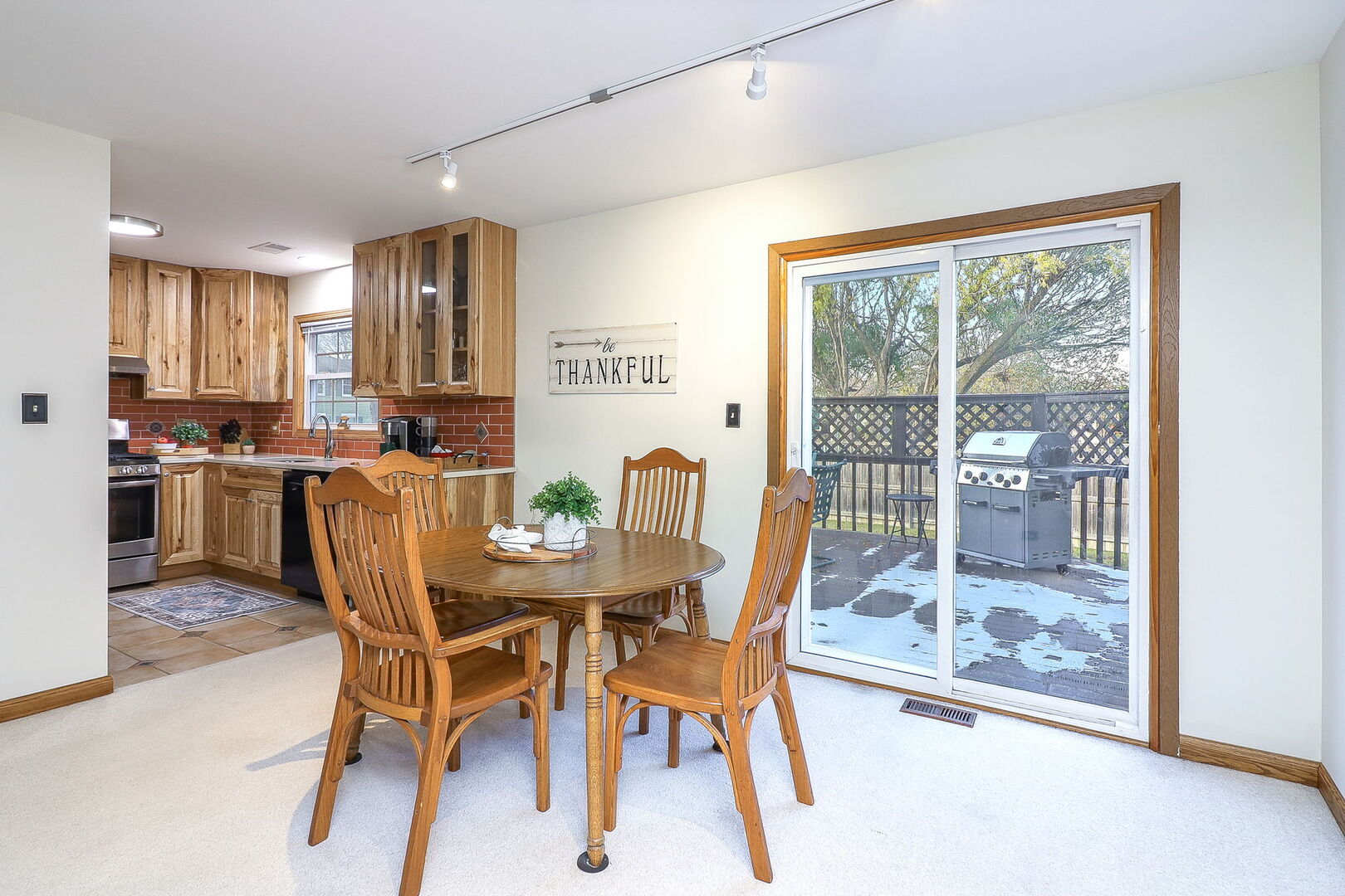 4493 Capstan Drive Hoffman Estates, IL 60192 - Photo 12 of 26 a dining room with furniture and a floor to ceiling window