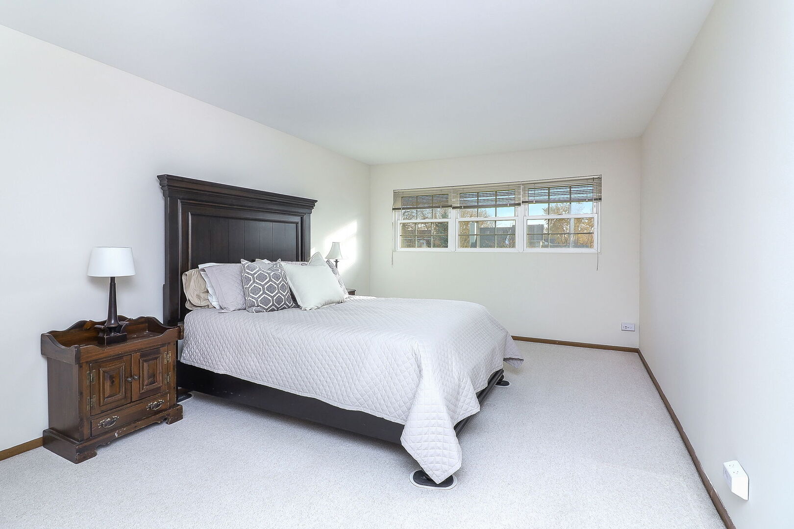 4493 Capstan Drive Hoffman Estates, IL 60192 - Photo 20 of 26 a bedroom with a bed dresser and a window