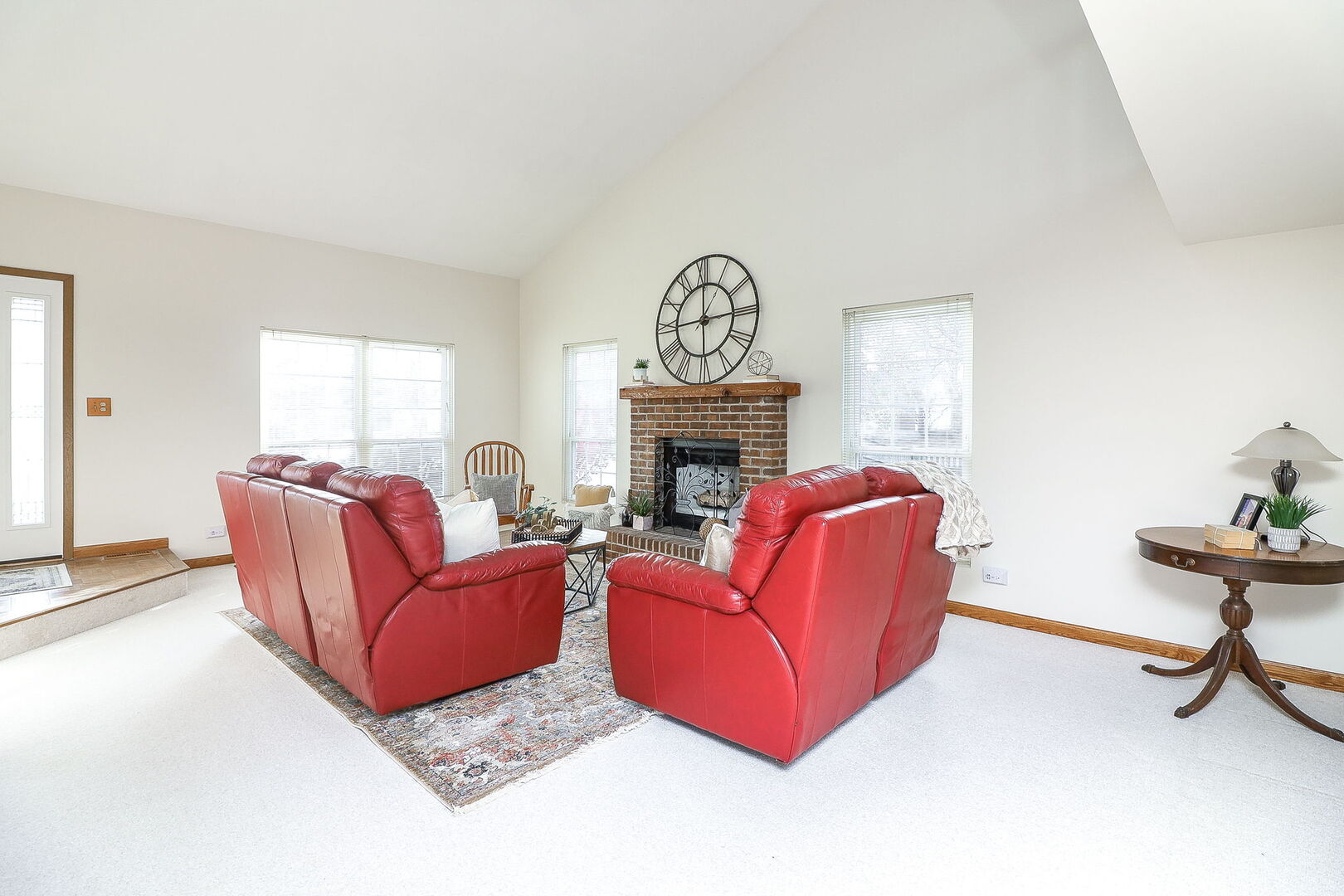 4493 Capstan Drive Hoffman Estates, IL 60192 - Photo 7 of 26 a living room with furniture a fireplace and a window