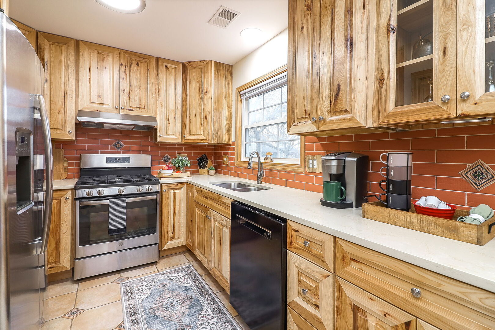 4493 Capstan Drive Hoffman Estates, IL 60192 - Photo 9 of 26 a kitchen with granite countertop stainless steel appliances a sink and cabinets