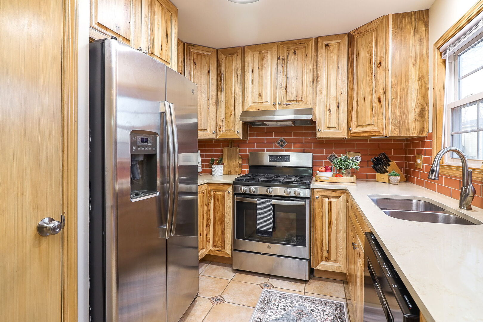 4493 Capstan Drive Hoffman Estates, IL 60192 - Photo 10 of 26 a kitchen with a refrigerator sink and cabinets