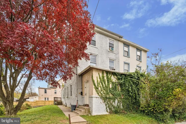 a view of a building with a yard